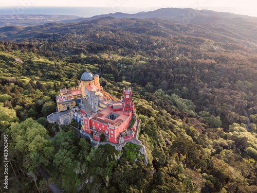 Canvas Print Aerial view of Pena Palace, a colourful Romanticist castle building on hilltop during a beautiful sunset, Sintra, Lisbon, Portugal