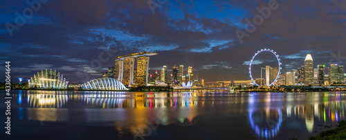 Wide panorama of Singapore cityscape at night.