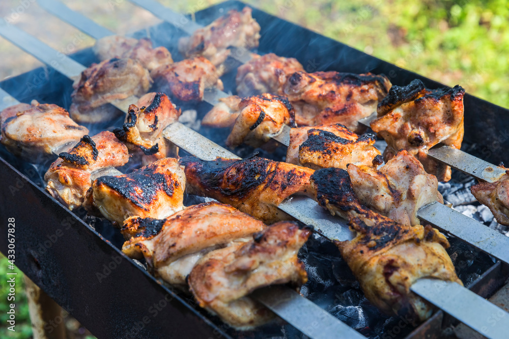 Burnt chicken kebab on the grill Burnt chicken kebab on the grill