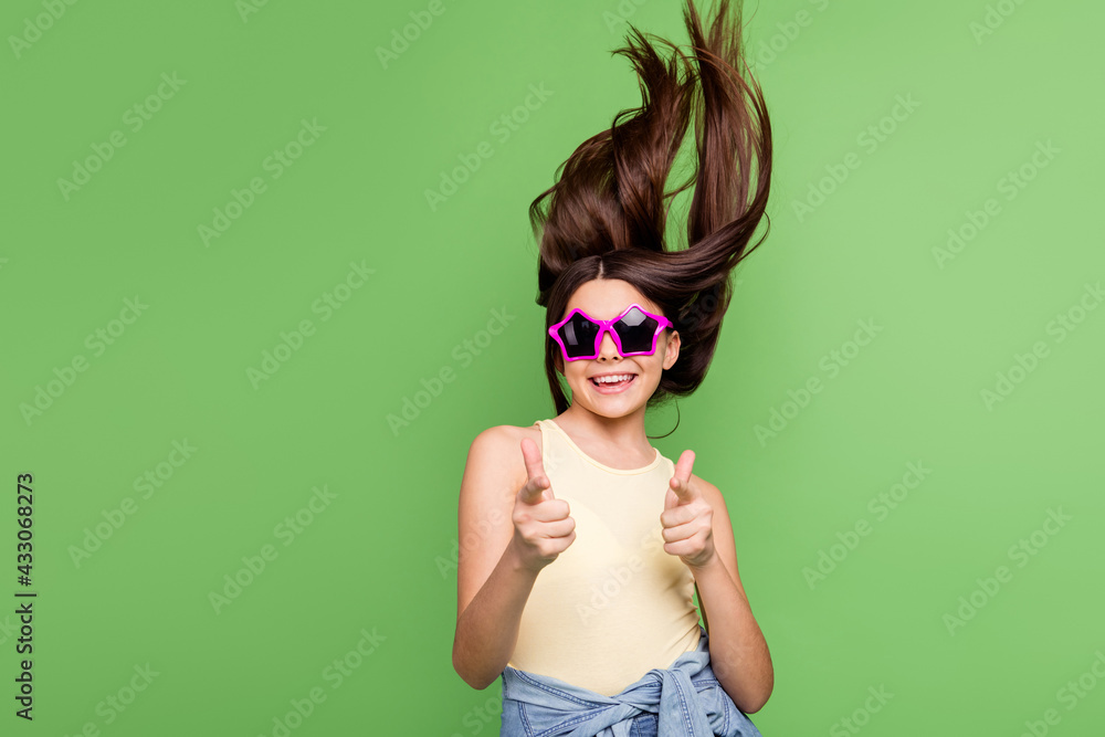 Photo of excited positive person toothy smile direct fingers camera you isolated on green color background