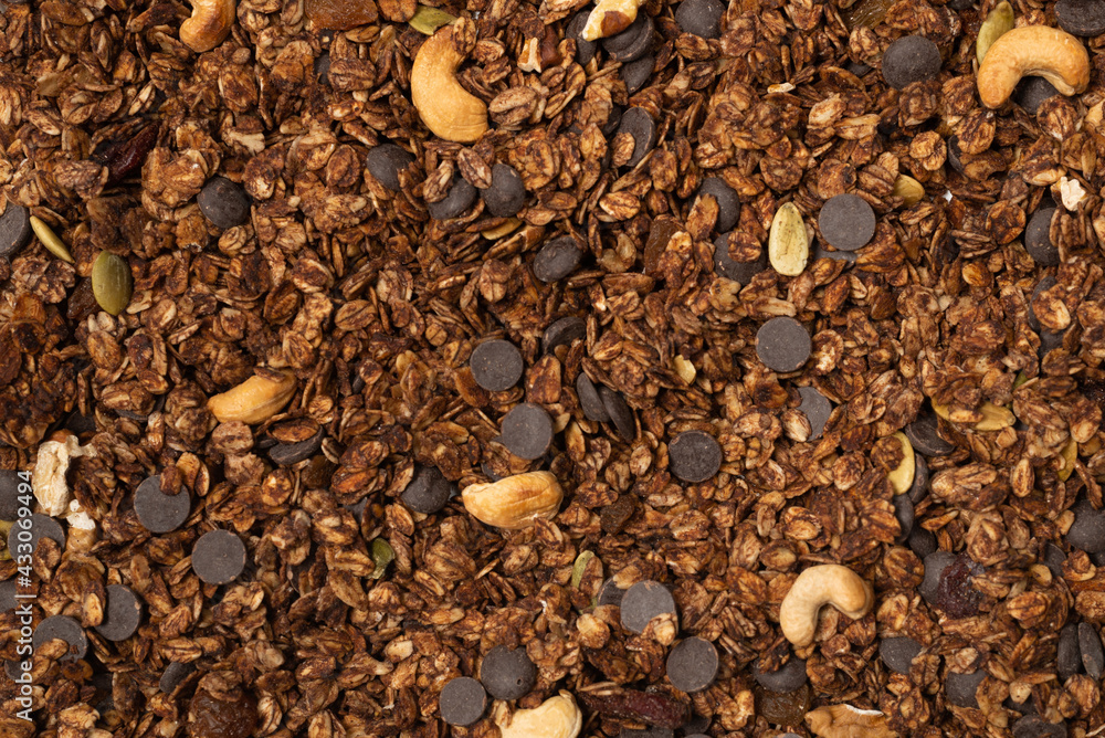 Chocolate granola cereal with nuts background. Chocolate granola cereal with nuts background.