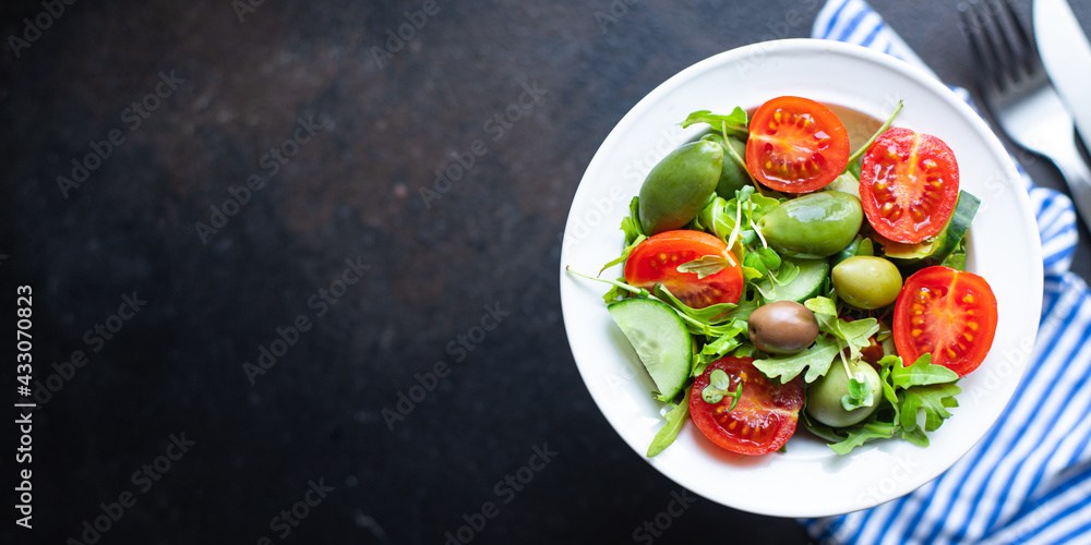 salad olive fruit vegetable olives tomato cucumber, lettuce mix leaves snack keto or paleo diet meal diet vegan or vegetarian food copy space food background rustic. top view salad olive fruit vegetable olives tomato cucumber, lettuce mix leaves snack keto or paleo diet meal diet vegan or vegetarian food copy space food background rustic. top view