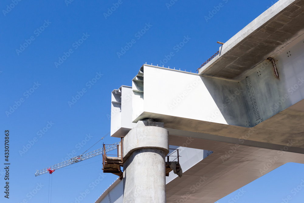 Structures made of concrete and metal. The process of building an automobile overpass. Road construction. Structures made of concrete and metal. The process of building an automobile overpass. Road construction.