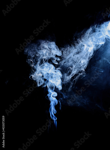 white fog or smoke from the burning of the fuel On a black background