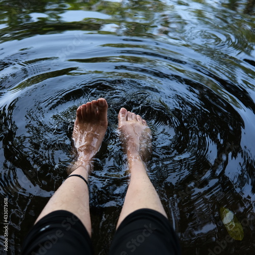 Fototapeta Naklejka Na Ścianę i Meble -  feet in water