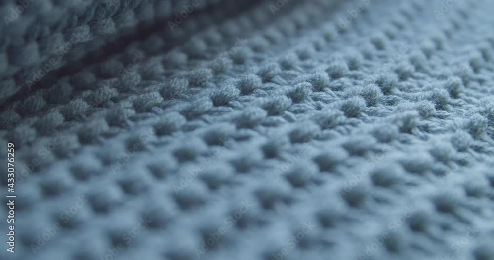 Texture of knitted grey blanket, closeup view Texture of knitted grey blanket, closeup view