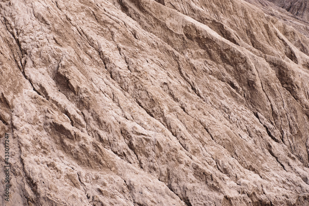 Naklejka premium Red rocks slope looks like martian landscape. Textured background.