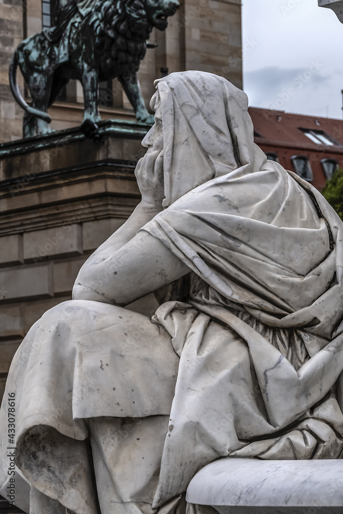 Fototapeta premium Monument of Germany's poet, philosopher and historian Friedrich Schiller (1871) near Concert Hall on Gendarmenmarkt Square in Berlin, Germany.