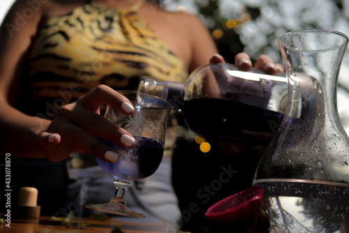 Black woman having Brazilian drink with fruit