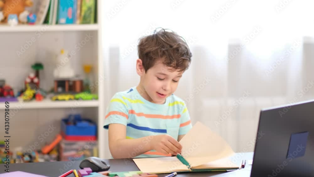 playful boy tears paper, relieves stress after class. playful boy tears paper, relieves stress after class.