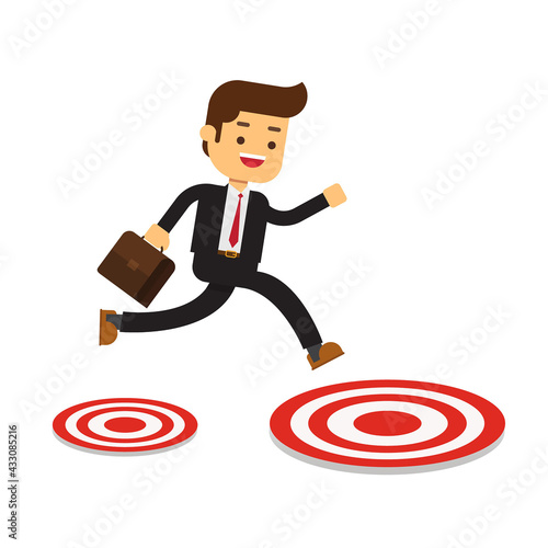 Businessman jumping to big target