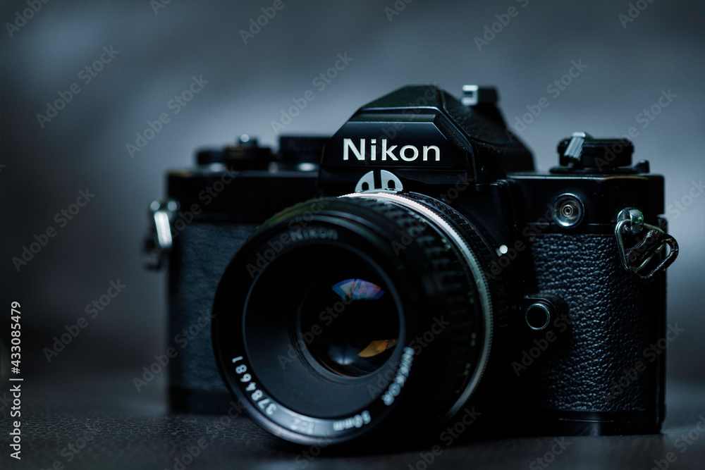 Toronto, Ontario, Canada - Circa 2019: An old Nikon slr 35 mm film camera  along with a 50mm portrait lens against grey background. Stock Photo |  Adobe Stock