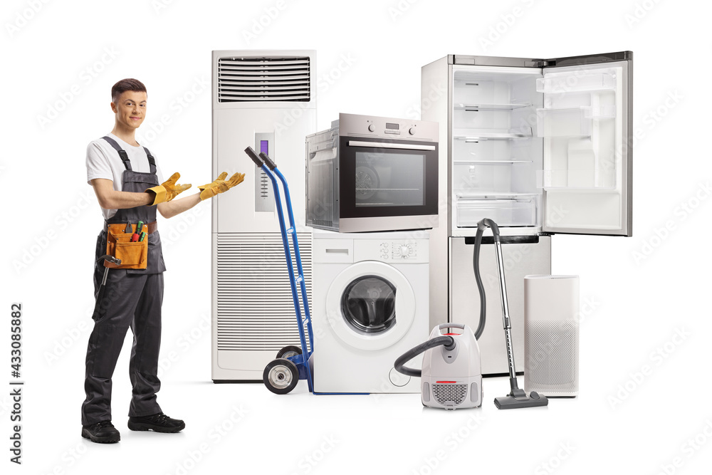 Full length portrait of a young repairman showing home electrical appliances Full length portrait of a young repairman showing home electrical appliances