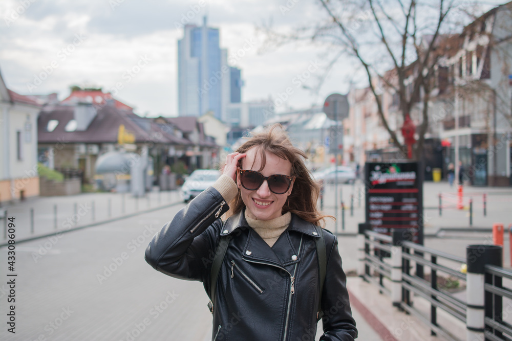 Fototapeta premium Summer sunny lifestyle fashion portrait of young stylish hipster woman walking