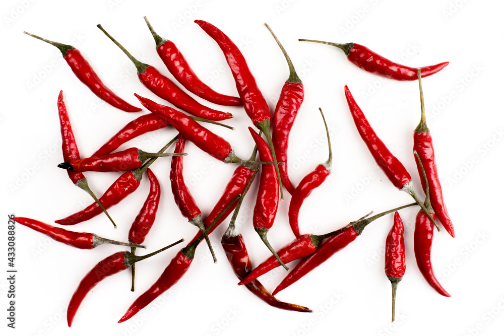 Hot chili Thai fingerling peppers flat lay on white Hot chili Thai fingerling peppers flat lay on white