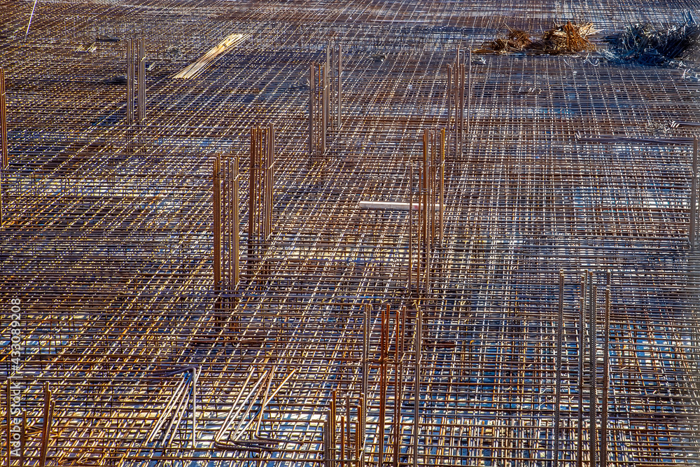 Fototapeta premium Billets of reinforcement at the construction site. New construction. Reinforced concrete construction.