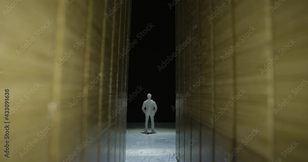 Slider shot push into model figure of miniature man and women in corridor hallway, 2 clips Slider shot push into model figure of miniature man and women in corridor hallway, 2 clips