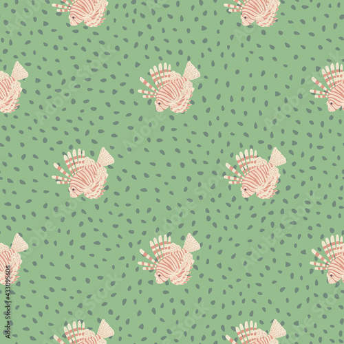 Pink colored lionfish silhouettes seamless pattern in nature theme. Green dotted background. Abstract style.