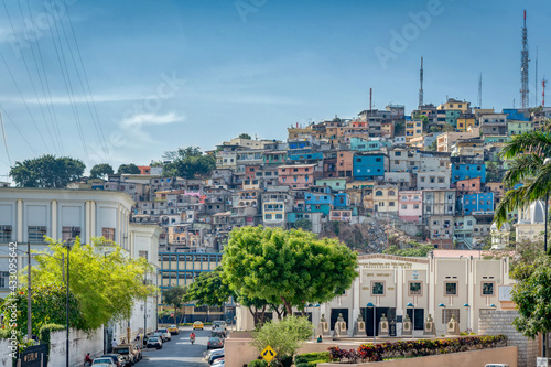 Guayaquil, Guayas, Ecuador - November, 2013: A view of a neighborhood and Cerro del Carmen (Carmen's Hill), in Guayaquil, with the Fireman Mueseum in the foreground. Sunny summer morning. © alanfalcony