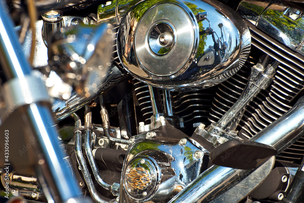 Fototapeta premium Motorcycle engine closeup. chrome engine parts. Shiny smooth details.