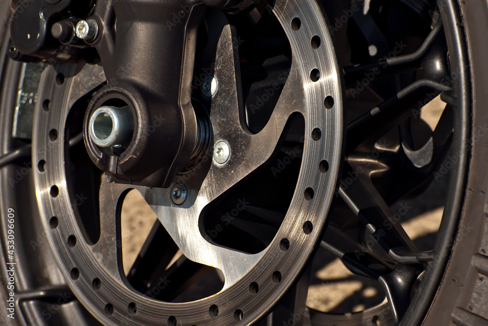 Motorcycle wheel closeup. Motorcycle metal parts. Biker meeting in the city. Motorcycle wheel closeup. Motorcycle metal parts. Biker meeting in the city.