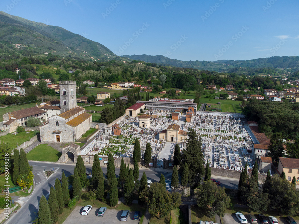 Naklejka premium Aerial view of he abbey of San Pietro, an important Catholic place of worship in Camaiore, Lucca, Italy
