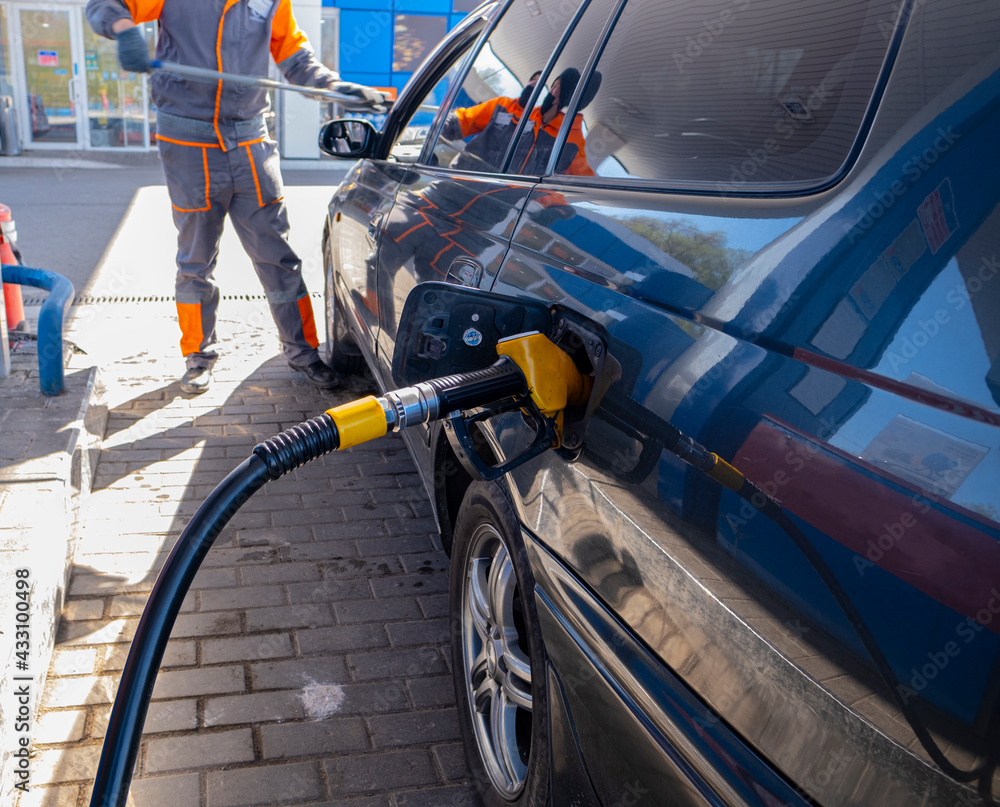 The pistol is placed in the gas tank of the car and fills with gasoline