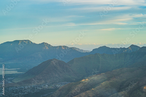 High angle aerial view of tropical mountains from above during golden hour