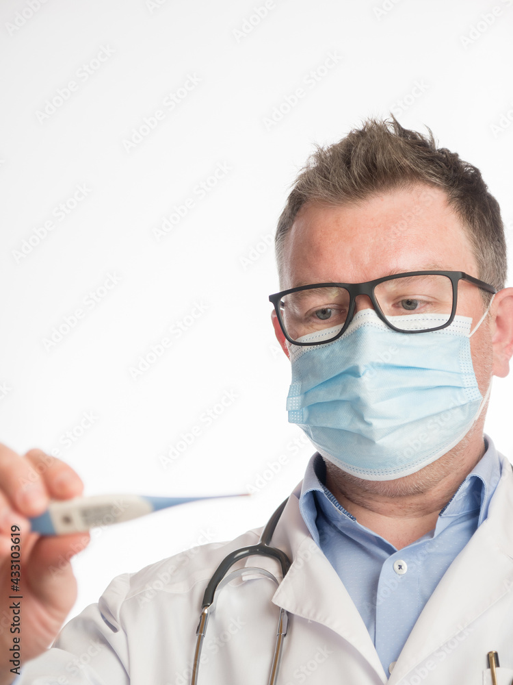 Portrait of a doctor holding a thermometer Portrait of a doctor holding a thermometer