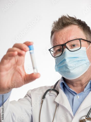 Portrait of a doctor holding a test tube
