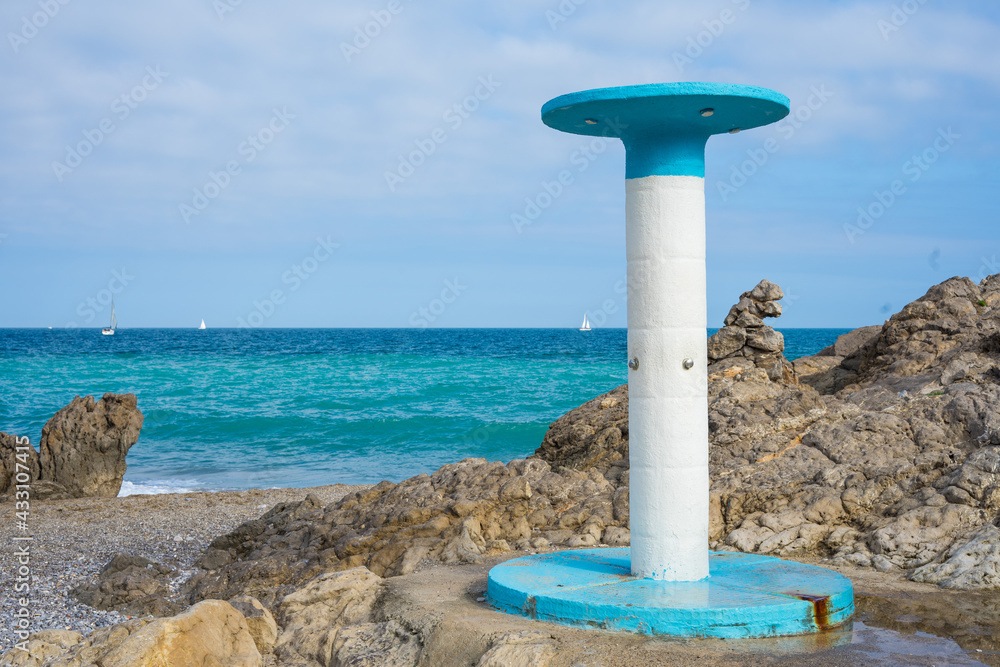 white and blue beach shower typical of beach white and blue beach shower typical of beach