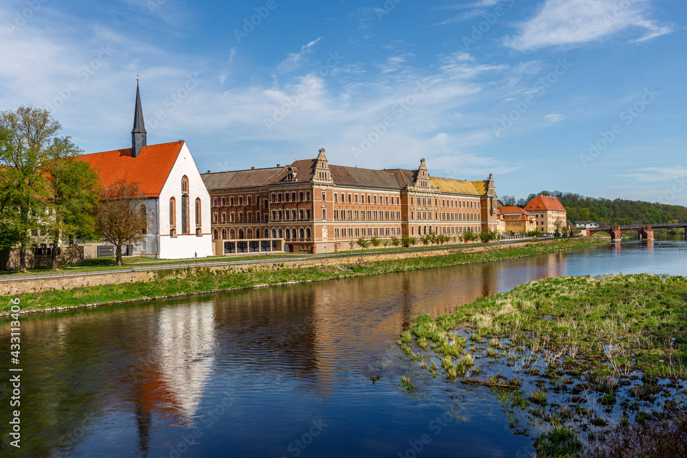 Grimma, Saxony, Germany- 05 11 2021, the small town on the river Mulde -Modern flood protection wall in the style of the historic city wall, Augustin High School