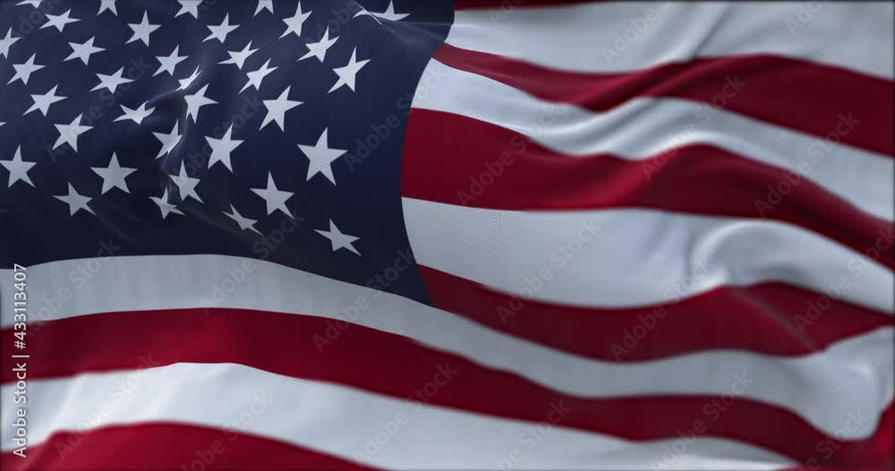 close up view of the american flag waving in the wind. close up view of the american flag waving in the wind.