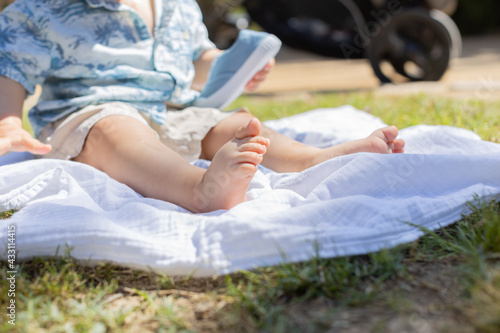Baby barefoot in a park 