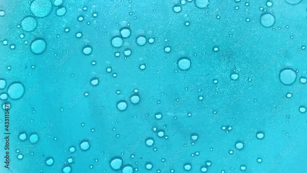 Abstract blue or turquoise background with floating circles and shimmering particles
Abstract blue or turquoise background with floating circles and shimmering particles