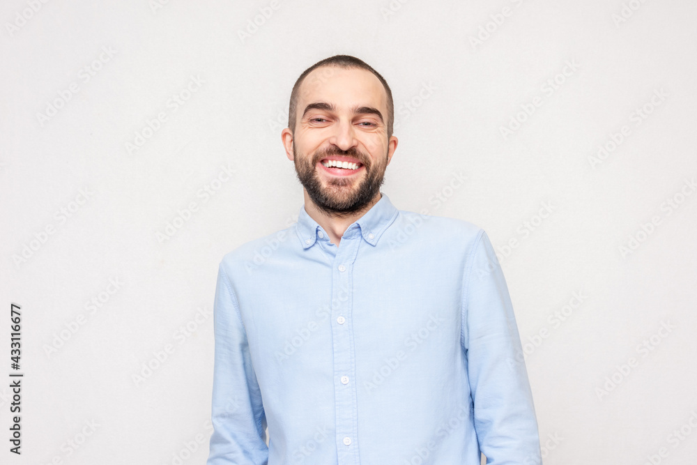 Laughing loudly nice bearded man, concept of positive emotions of people, white background, copy space Laughing loudly nice bearded man, concept of positive emotions of people, white background, copy space