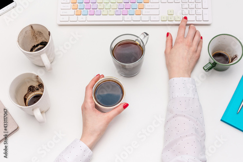 Wallpaper Mural Office work concept, desk with coffee cups and other office attributed, woman working at the computer, female hands, top view, flat lay Torontodigital.ca