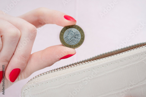 Fototapeta Woman's hand with belarusian coins, closeup, cropped image, poverty concept