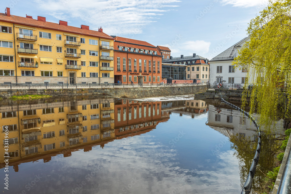 Beautiful city landscape view of colorful buildings along river side. Uppsala.  Sweden.  Europe. 