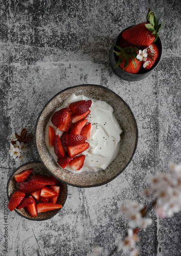 yogurt with strawberries and flowers
