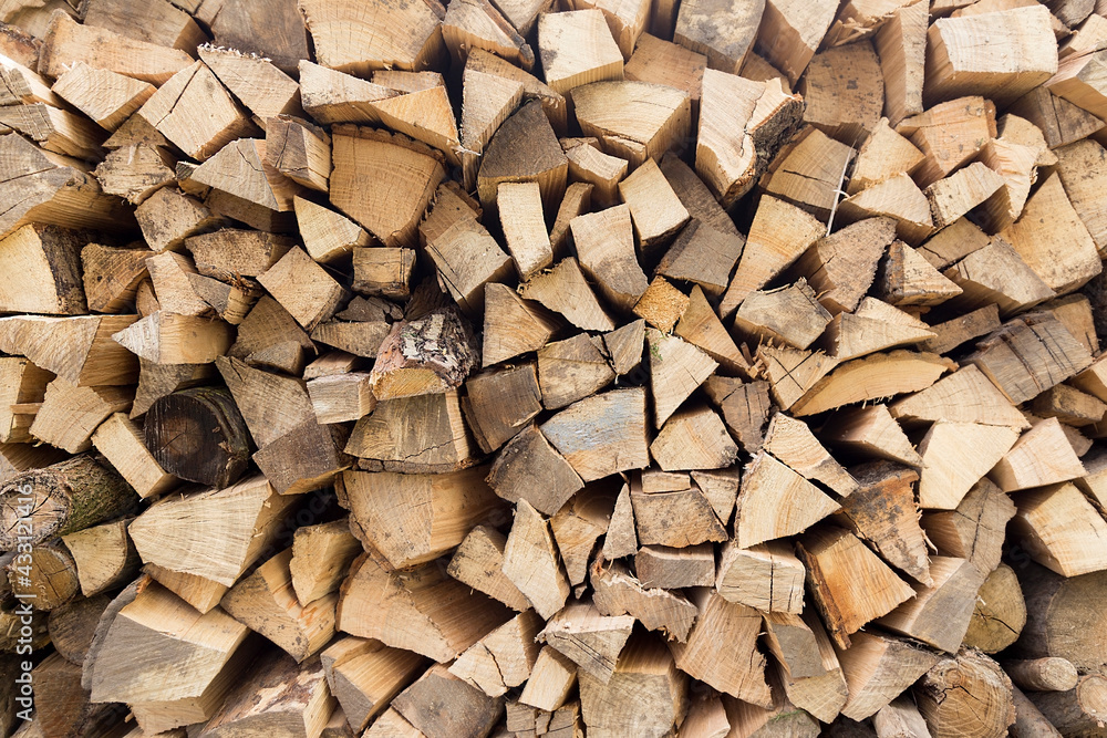 There was a pile of chopped firewood. Folded dry logs of firewood close up. Firewood for winter heating in the countryside There was a pile of chopped firewood. Folded dry logs of firewood close up. Firewood for winter heating in the countryside