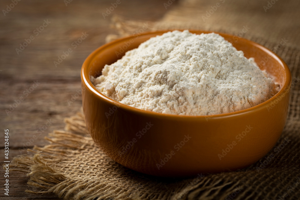 Bowl with wheat flour on the table. Bowl with wheat flour on the table.