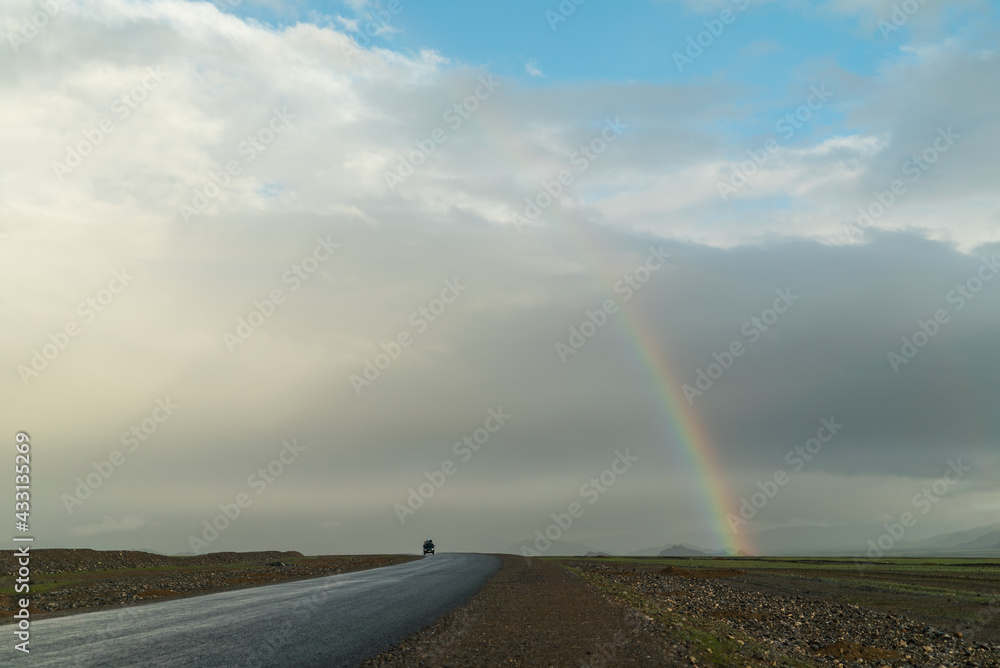 the beginning of a rainbow on a beautiful mountain sunny landscape