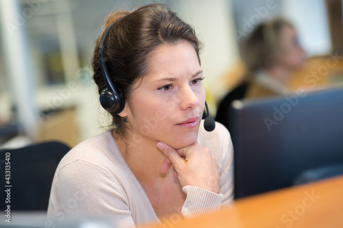 female worker with handset in office