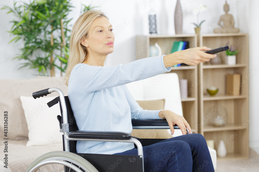 portrait of disabled senior woman watching tv portrait of disabled senior woman watching tv