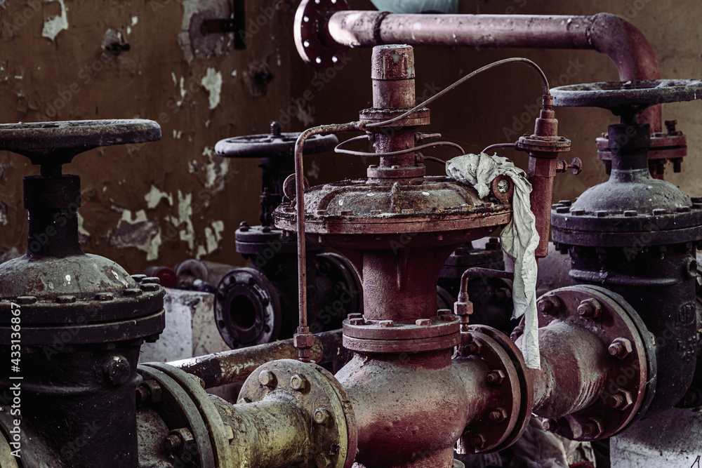 abandoned industrial area with pipes and taps abandoned industrial area with pipes and taps