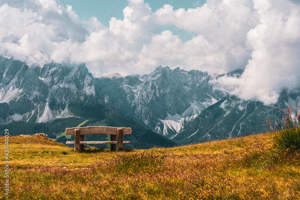 Wooden bench on hiking trails in the Dolomites, Italy. Wooden bench on hiking trails in the Dolomites, Italy.
