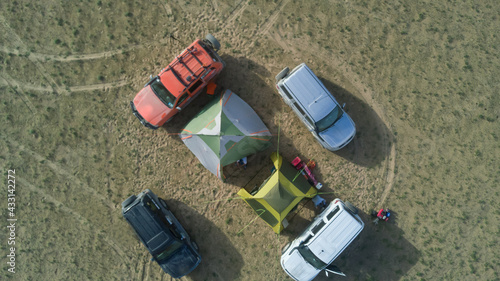 car travelers base camp in the desert top view