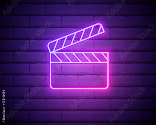 Glowing neon Movie clapper icon isolated on brick wall background. Film clapper board icon. Clapperboard sign. Cinema production or media industry concept. Vector Illustration