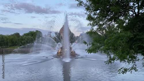 Big beautiful fountain in the city park in the evening
